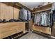 Organized walk-in closet with custom shelving, drawers, and ample storage space for shoes and clothing at 806 Flora View Dr, Erie, CO 80516