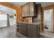 Stylish kitchen with wooden accents, stainless steel appliances, and an open view into the living area at 131 S Grove St, Denver, CO 80219