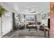 Cozy living room with a large window for lots of natural light, sofa, and stylish decor at 131 S Grove St, Denver, CO 80219