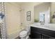 Bright bathroom features a shower-tub combo, modern vanity, and neutral decor at 5188 Ward Rd, Wheat Ridge, CO 80033