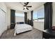 Inviting bedroom featuring large windows and neutral carpet at 5188 Ward Rd, Wheat Ridge, CO 80033