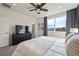 Comfortable bedroom featuring a large dresser, ceiling fan, and neutral tones at 5188 Ward Rd, Wheat Ridge, CO 80033