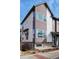 Modern townhome with mixed siding, large windows, and contemporary architectural details at 5188 Ward Rd, Wheat Ridge, CO 80033
