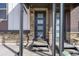 Modern townhome porches showing clean lines, brick accents, and stylish entry doors at 5188 Ward Rd, Wheat Ridge, CO 80033