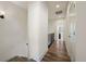 Second floor hallway with hardwood floors and access to multiple rooms at 5188 Ward Rd, Wheat Ridge, CO 80033