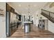 Stylish kitchen with stainless steel appliances, kitchen island and hardwood floors at 5188 Ward Rd, Wheat Ridge, CO 80033