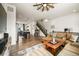 Bright living room with wood floors, large windows, and comfortable sectional sofa at 5188 Ward Rd, Wheat Ridge, CO 80033
