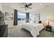 Spacious main bedroom featuring neutral tones, plush carpet, and ample natural light at 5188 Ward Rd, Wheat Ridge, CO 80033