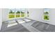 Bright bedroom with plush carpet, large windows, and natural light at 11493 E Briarwood Cir, Centennial, CO 80112