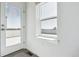 Bright hallway with access to a rooftop patio through a glass door and natural light from a window at 11493 E Briarwood Cir, Centennial, CO 80112