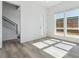 Well-lit living room with hardwood floors, staircase and modern design elements at 11493 E Briarwood Cir, Centennial, CO 80112