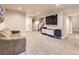 Finished basement with gray carpet, white trim and entertainment area at 2104 Vineyard Dr, Castle Rock, CO 80104