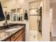 Well-appointed bathroom featuring granite countertops, glass-enclosed shower, and modern fixtures at 2104 Vineyard Dr, Castle Rock, CO 80104
