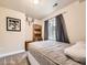 Cozy bedroom featuring a queen bed, gray curtains, and a mounted deer antler decor at 2104 Vineyard Dr, Castle Rock, CO 80104