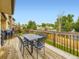 Wooden deck features a wrought iron table and chairs, plus mountain views at 2104 Vineyard Dr, Castle Rock, CO 80104