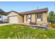 Lovely single-Gathering home with a brick facade, attached garage, and a nicely landscaped front yard at 2104 Vineyard Dr, Castle Rock, CO 80104