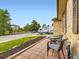 Inviting front porch area featuring a brick tile surface and a comfortable outdoor seating set at 2104 Vineyard Dr, Castle Rock, CO 80104