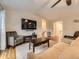 Comfortable living room with vaulted ceilings, a large TV, and ample seating for relaxation and entertainment at 2104 Vineyard Dr, Castle Rock, CO 80104