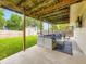 Covered patio with outdoor furniture overlooking a large, grassy yard at 2104 Vineyard Dr, Castle Rock, CO 80104