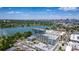 Aerial view of a modern condo building, lake, and downtown skyline at 4200 W 17Th Ave # 212, Denver, CO 80204