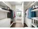 Well-organized walk-in closet with custom shelving, storage drawers, and easy access to the main bedroom at 4200 W 17Th Ave # 212, Denver, CO 80204