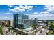 Stunning exterior view of a modern glass condo with a rooftop pool and green space at 4200 W 17Th Ave # 212, Denver, CO 80204
