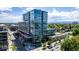 Modern glass condo building with balconies, rooftop terrace, and vibrant urban setting at 4200 W 17Th Ave # 212, Denver, CO 80204