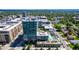 Exterior view of the condo building with a rooftop pool and landscaped gardens at 4200 W 17Th Ave # 212, Denver, CO 80204