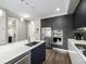 Contemporary kitchen features stainless steel appliances, a large island with seating, and modern finishes at 4200 W 17Th Ave # 212, Denver, CO 80204