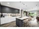 Modern kitchen with stainless steel appliances, gray cabinets, and large center island at 4200 W 17Th Ave # 212, Denver, CO 80204