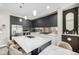 Elegant kitchen features stainless steel appliances, gray cabinets, and an island with bar seating at 4200 W 17Th Ave # 212, Denver, CO 80204