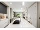 Bright, open kitchen with marble countertops, pendant lighting, and a large island, open to the living room at 4200 W 17Th Ave # 212, Denver, CO 80204