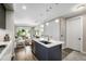 Modern kitchen with a marble countertop island and stainless steel appliances, open to the living room at 4200 W 17Th Ave # 212, Denver, CO 80204