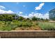 An eye-level image showcases serene landscape design featuring lush greenery with trees and flowers at 4200 W 17Th Ave # 212, Denver, CO 80204