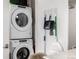 This photo showcases an efficient Whirlpool stacked washer and dryer, maximizing space in a modern living area at 4200 W 17Th Ave # 212, Denver, CO 80204