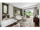 Bright living room with stylish rug, modern sofa, and elegant decorations at 4200 W 17Th Ave # 212, Denver, CO 80204