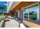 This spacious outdoor patio includes stylish seating, a dining table, and a charming pendant light at 4200 W 17Th Ave # 212, Denver, CO 80204