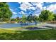 Colorful playground with modern equipment surrounded by lush green lawns and mature trees for Gathering fun at 4200 W 17Th Ave # 212, Denver, CO 80204