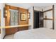 Bedroom featuring a built-in desk and window overlooking trees at 1140 Ski Hill Rd # 25, Breckenridge, CO 80424