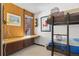 Bedroom with bunk beds and a window with wooded views at 1140 Ski Hill Rd # 25, Breckenridge, CO 80424