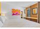 Bright bedroom with a queen bed, built-in desk, and window views at 1140 Ski Hill Rd # 25, Breckenridge, CO 80424