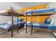 Bunk beds in a bedroom with a mustard-yellow wall at 1140 Ski Hill Rd # 25, Breckenridge, CO 80424