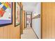 Hallway with wood paneling and framed artwork at 1140 Ski Hill Rd # 25, Breckenridge, CO 80424