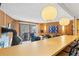 Open kitchen with breakfast bar, stainless steel appliances and wood cabinets at 1140 Ski Hill Rd # 25, Breckenridge, CO 80424