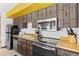 Kitchen with stainless steel appliances and wood cabinets at 1140 Ski Hill Rd # 25, Breckenridge, CO 80424