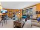 Comfortable living area featuring a unique fireplace and access to a private balcony with scenic views at 1140 Ski Hill Rd # 25, Breckenridge, CO 80424