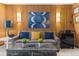 Living room with wood wall and comfortable seating at 1140 Ski Hill Rd # 25, Breckenridge, CO 80424