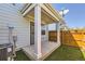 Enclosed back patio with artificial grass and secure door to home at 7453 E 26Th Ave # 2, Denver, CO 80238