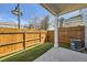 Cozy backyard with a wood fence, artificial turf, and concrete patio at 7453 E 26Th Ave # 2, Denver, CO 80238