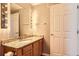 Bright bathroom featuring vanity with granite countertops and decorative lighting at 7453 E 26Th Ave # 2, Denver, CO 80238